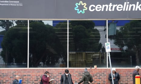 People queue outside a Centrelink office in Preston, Melbourne