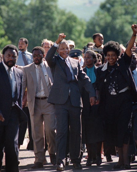 Nelson Mandela and wife Winnie raise fists upon Mandela release from Victor Verster prison, 11 February 1990.