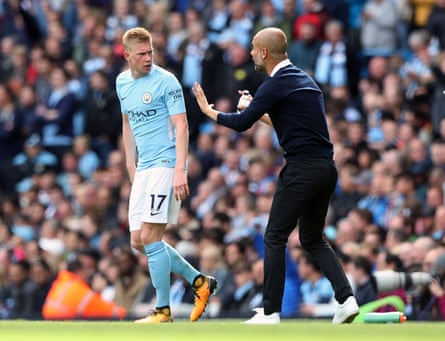 Manchester City manager Pep Guardiola issues Kevin De Bruyne with instructions at the Etihad Stadium