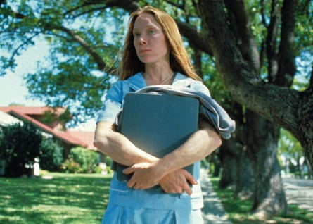 A teenage girls carrying books.