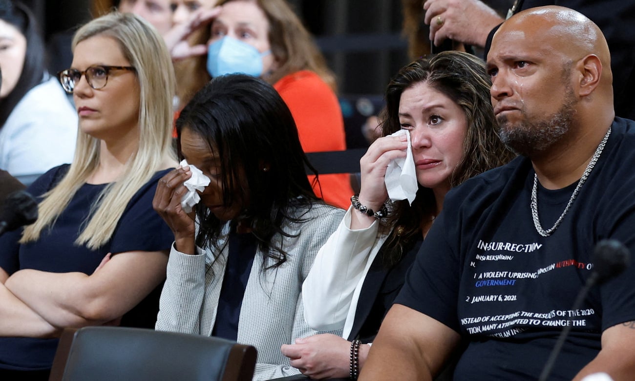 Sandra Garza, partner of Brian Sicknick and Serena Liebengood, widow of US Capitol police officer Howie Liebengood cry as Erin Smith, widow of DC police officer Jeffrey Smith and former Washington police officer Harry Dunn look on,