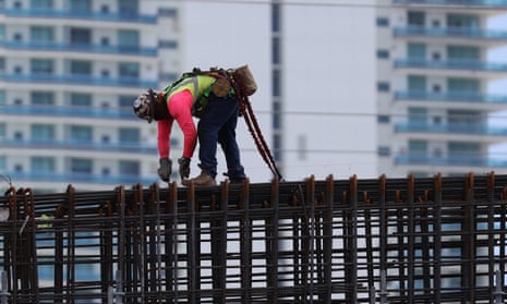 A construction worker on the ‘Signature Bridge’ in Miami in 2021. Florida does not have a state labor department to oversee the third largest workforce in the US.