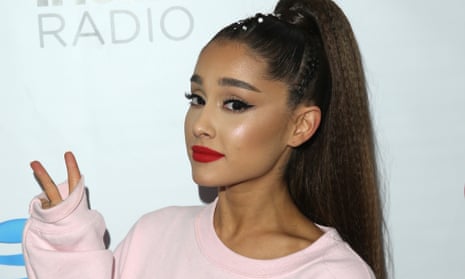 Ariana Grande acknowledged her new hand tattoo was missing a symbol but said the design won’t last, as skin on the palm regrows faster than that on the rest of the body.