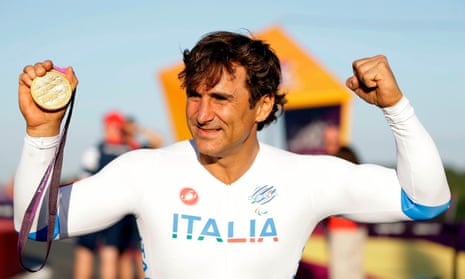 Alex Zanardi holding his gold medal for the road cycle individual time trial H4 category at the 2012 Paralympic Games, at Brands Hatch motor racing circuit near London.