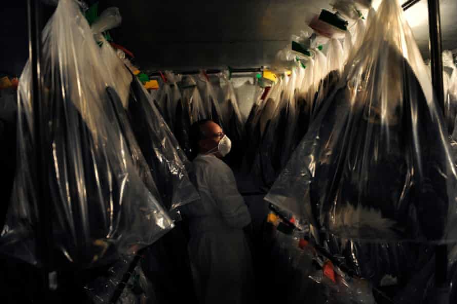 Wildlife repository specialist Dennis Wiist looks for a place to hang eagles ready to be sent out in one of the two freezers. All useable parts of the eagle bodies from wherever they fall are kept so Native American religious practitioners have the requisite eagle feathers, talons, etc. for their ceremonies.