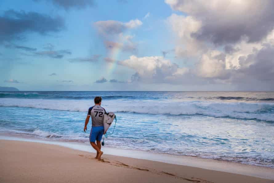 Jack Robinson walks along the beach in one of Make or Break’s stunning surf locations.