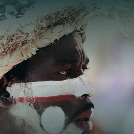 Profile of an Indigenous man in traditional dress and with painted face