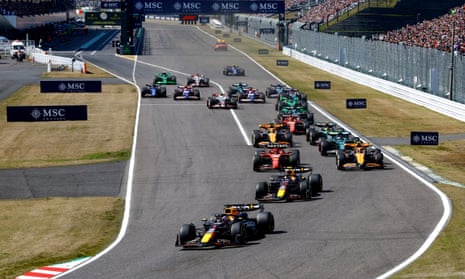 Red Bull's Max Verstappen leads the Japanese Grand Prix going into the first corner.