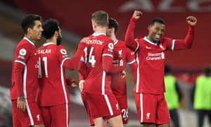 Liverpool player congratulate Georginio Wijnaldum (right) after the midfielder scored the second goal.
