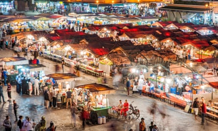 Dusk view of food stalls and crowds in Jemaa El Fna Square in Marrakech, Morocco