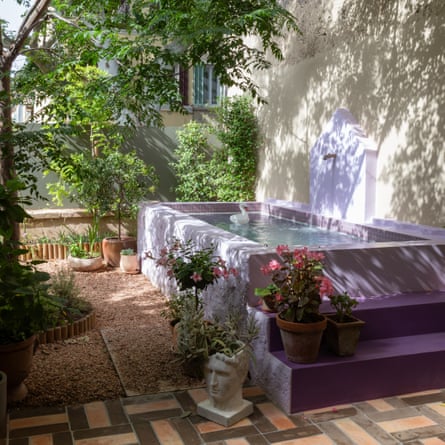 The small garden was a jungle when they bought the house, but now it’s a lilac-hued sanctuary.