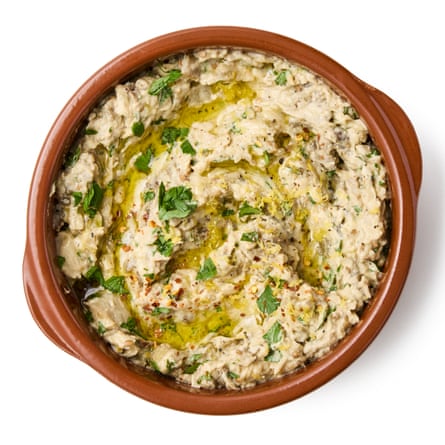 Felicity Cloake’s baba ganoush 8 Plate and garnishTransfer to a serving bowl, if necessary, then top with the remaining herbs and a scattering of pomegranate seeds (though definitely not required, they do look very pretty. Alternatively, add a little grated lemon zest or some chilli flakes for a dash of extra colour; up to you)…
