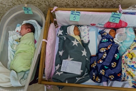 Babies sleep next to each other in a makeshift nursery underground in the outskirts of Kyiv, Ukraine