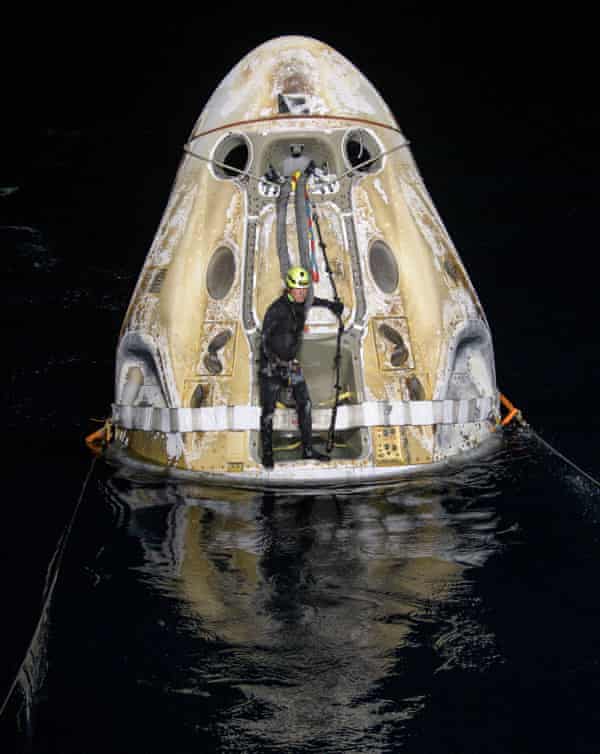 SpaceX returns four astronauts to Earth in darkness | Space | The Guardian