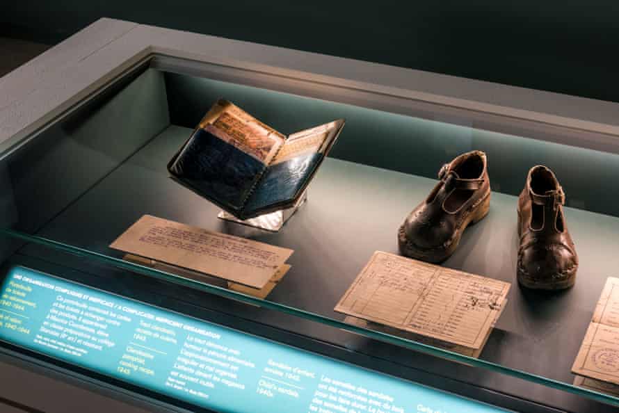 A schoolboy’s wallet filled with ration cards and wooden-soled children’s shoes