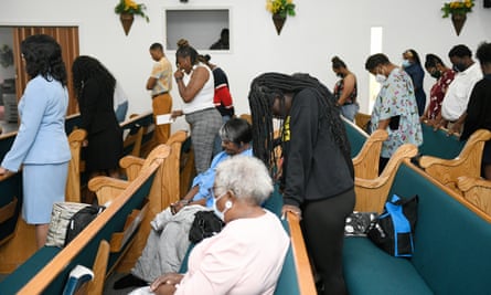 Congregants of Bethesda Worship and Healing Center pray during Sunday service.