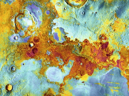 The spacecraft Mars Odyssey brought new imaging technology to photographing the planet, which meant the surface could be seen in both day and night. In 2006, daytime images (which show topography in black and white) were combined with night-time views (which show temperature, from cold blue to warm red). At night, bedrock exposed on the Meridiani Planum plain and in crater rims retains heat, so is relatively warm compared with dust-covered areas.