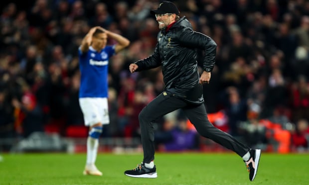 Jürgen Klopp dashes across the pitch after Liverpool scored a late winner to celebrate with his goalkeeper, Alisson.