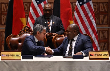 US secretary of state Antony Blinken shakes hands with Papua New Guinea's defence minister Win Bakri Daki as prime minister James Marape looks on in Port Moresby.