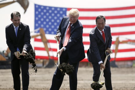 US President Donald Trump, centre, along with Wisconsin governor Scott Walker, left, and Foxconn chairman Terry Gou, participate in a groundbreaking event for the new Foxconn facility in 2018.