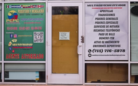 windows and a door covered up by signs