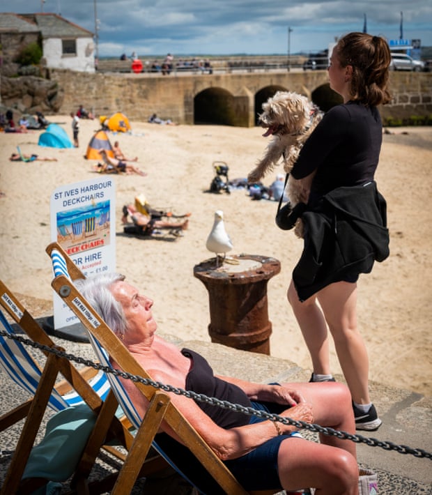 People at the beach in St Ives for British summer day feature