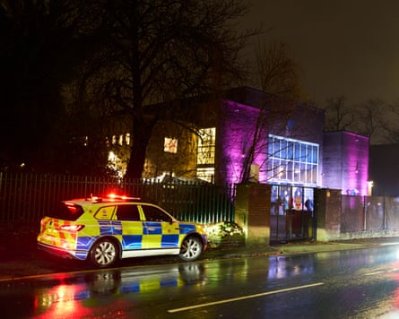 Police car parked outside the synagogue
