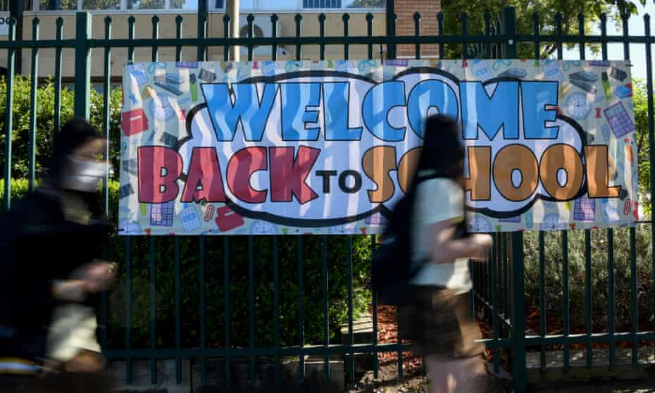 Students and 'Welcome back' banner