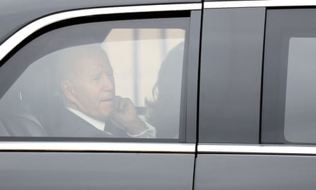 Joe Biden sits in his car outside Westminster Abbey.