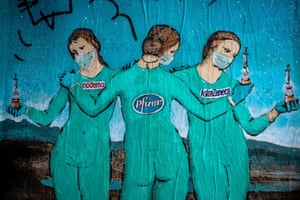 Barcelona, Spain‘The Three Vaccines’ by urban artist ‘TVBoy’ Salvatore Benintende shows three figures holding covid-vaccines from Moderna, Pfizer and AstraZeneca. Based on the 15th-century painting ‘Three Graces’ by Italian painter Raphael.