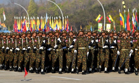 Members of the Myanmar military march at a parade ground to mark the country's Independence Day in Naypyidaw on January 4, 2023.