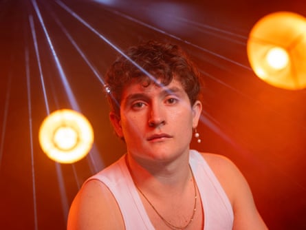 Closeup of Browne on stage in a white vest