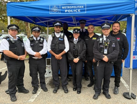 Frankie Williams (right) and fellow activist Shoaib Awan (third from right), with Met police officers at a community tool marking event.