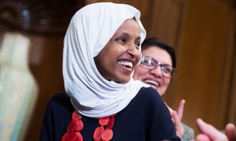 Ilhan Omar, with Rashida Tlaib, attends a rally in the US Capitol.