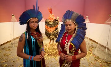 Glicéria Tupinambá (right, with her niece Jessica) in the Brazilian pavilion at Venice, which features the Tupinambá cloak, along with letters asking for its return.
