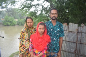 Farmer Faruk Hossain, who is moving from Chakla village to the city of Khulna with his wife Farida Yasmin and daughter.