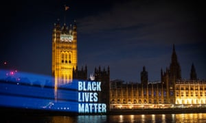 Black Lives Matter is projected onto the Houses of Parliament.