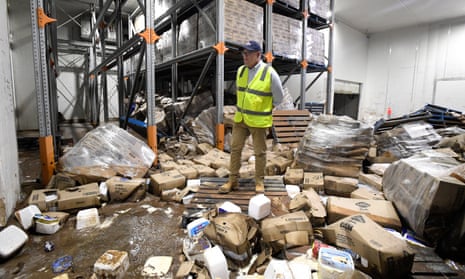 Then PM Scott Morrison inspects flood damage at the Norco factory in Lismore in March