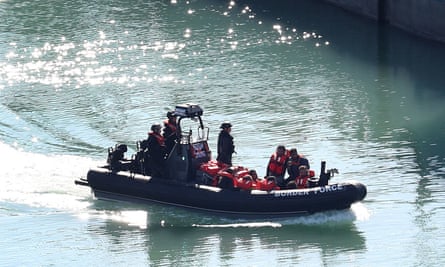A group of suspected migrants are brought to shore by Border Force officers at the Port of Dover in Kent after a number of small boat incidents in the Channel in September.