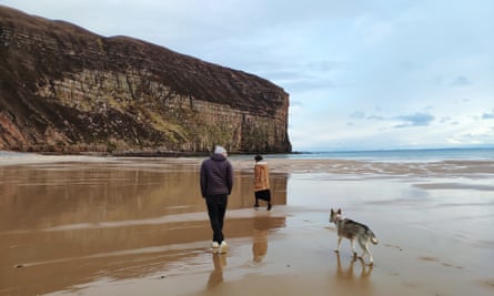 The writer with her partner and their dog at Rackwick.