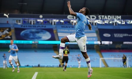 Raheem Sterling celebrates scoring the first goal actually given on the Premier League’s return