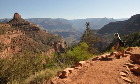 A hiker pauses near the top of the Bright Angel Trail.