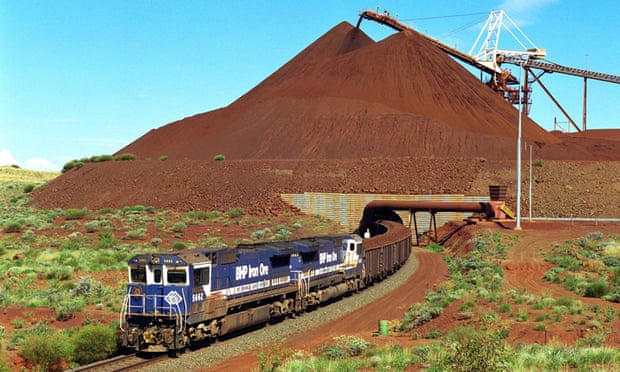 A train loaded with iron ore departs the Yandi mine in the Pilbara, Western Australia