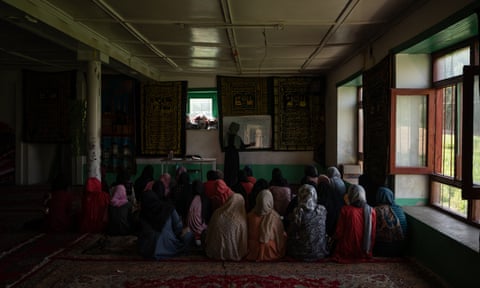 Girls participate in class in a secret school in Afghanistan.