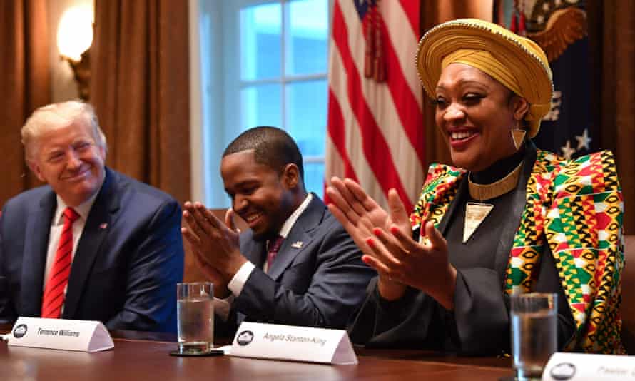 Donald Trump sits near Angela Stanton King during a meeting with African American leaders at the White House in February.