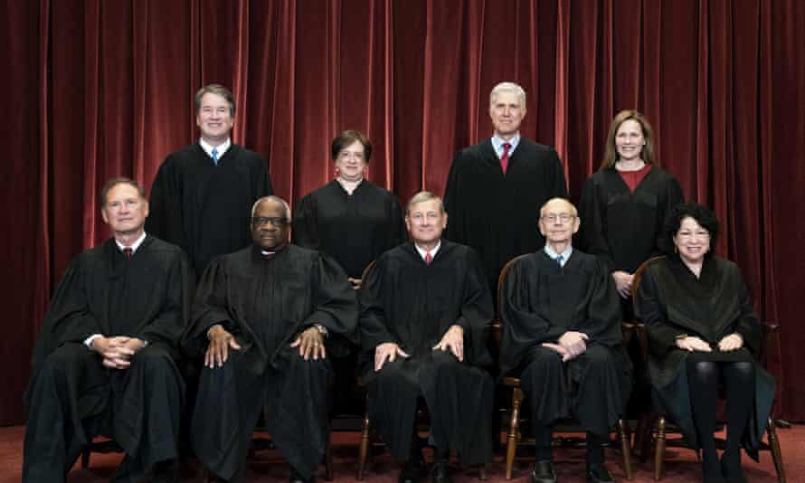 Members of the Supreme Court pose for a group photo at the Supreme Court in Washington, April 23, 2021. Seated from left are Samuel Alito, Clarence Thomas, Chief Justice John Roberts, Stephen Breyer and Sonia Sotomayor. Standing from left are Brett Kavanaugh, Elena Kagan, Neil Gorsuch and Amy Coney Barrett.