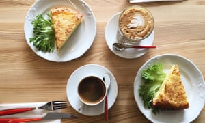Omelettes and coffee on a wooden table at T35 Bakery, Kalamaja, Tallinn, Estonia.