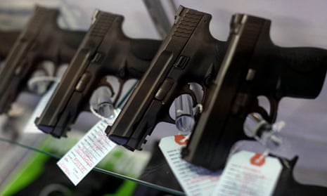 Handguns are seen for sale in a display case at Metro Shooting Supplies in Bridgeton, Missouri.