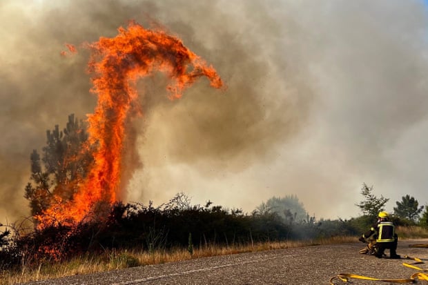 Firefighters at work in the village of A Cañiza in Galicia region ofSpain. According to the European Forest Fire Information System this is the worst year of wildfires in Spain in 30 years.