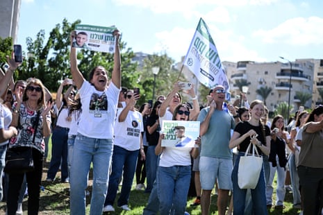 Friends and family of released Israeli hostage Matan Angrest celebrate as they see the first pictures of his release.